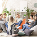 a group of people in a room socializing