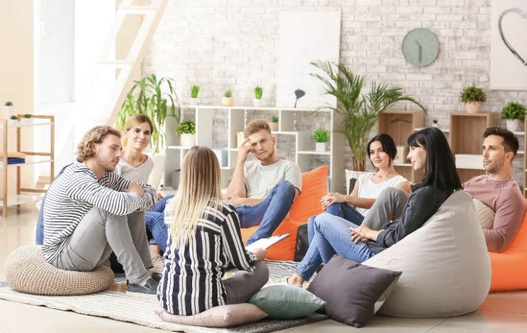 a group of people in a room socializing